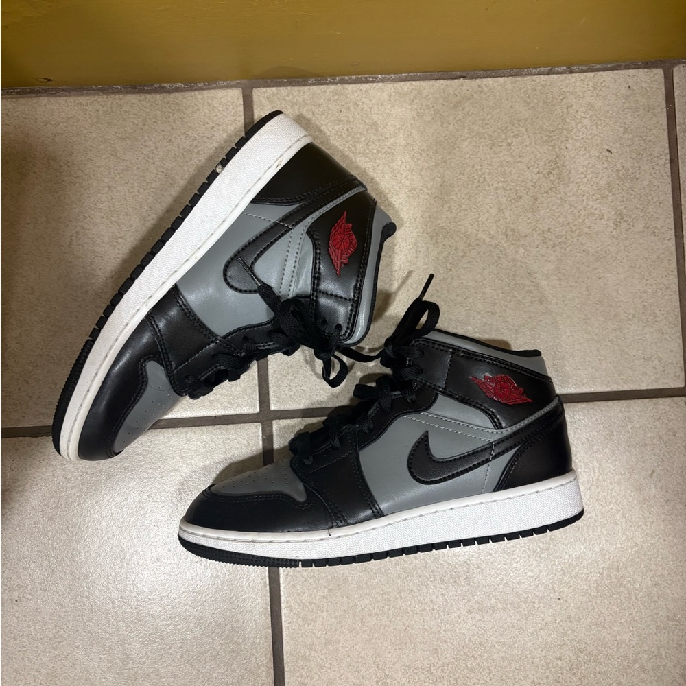 Jordan Black and Gray Kids Sneakers with Red Accent